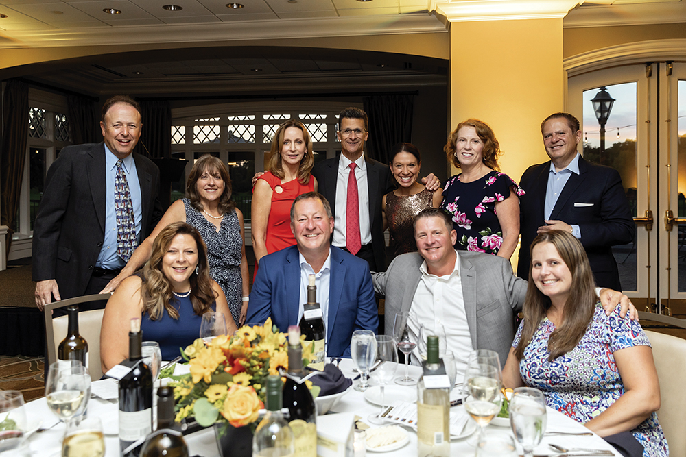 Readerlink Presenting Sponsor Table including Kristen &amp; Jon Anderson, Mike &amp; Tanya Nolan (front row), Dr. Allen &amp; Christine Bloom, Toni &amp; Mike Havala, Dionne Miller, Kathy &amp; Dennis Abboud (back row)