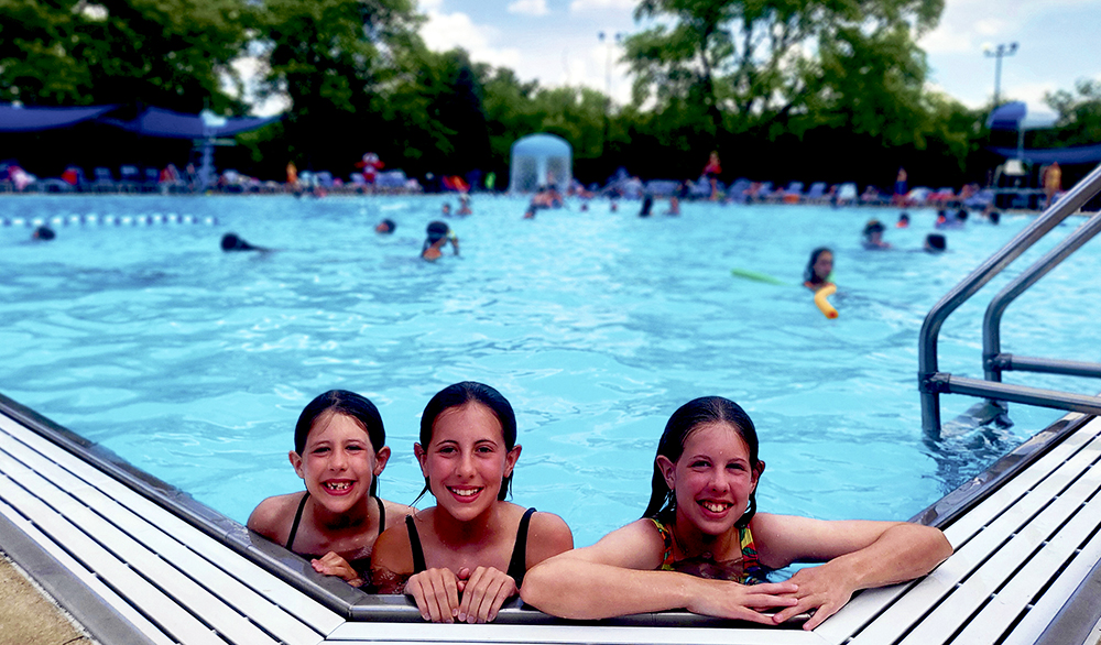 Longtime members Sloane, Ellery and Teegan Smith enjoy a summer swim this season at the pool.