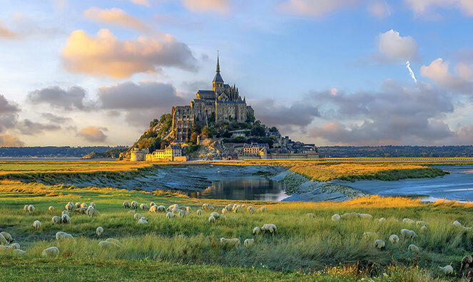 Famous Le Mont Saint-Michel tidal island in Normandy, northern France at sunset