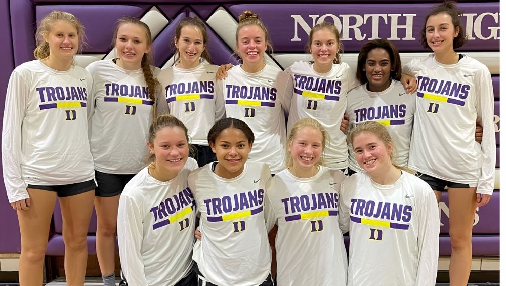 Among the Trojans teammates pictured, Ryann Wendt (far left), Violet Mitchell (third from left), Maggie Fleming (
fourth from left), and Kate Gross (fifth from left) shared both friendship and success on the court.