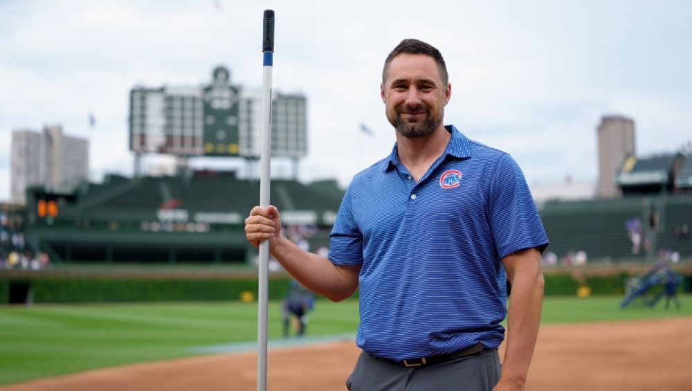 Dan Kiermaier prepares the field at historic Wrigley Field during the club’s 150th anniversary as a National League franchise.