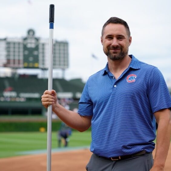 Dan Kiermaier prepares the field at historic Wrigley Field during the club’s 150th anniversary as a National League franchise.