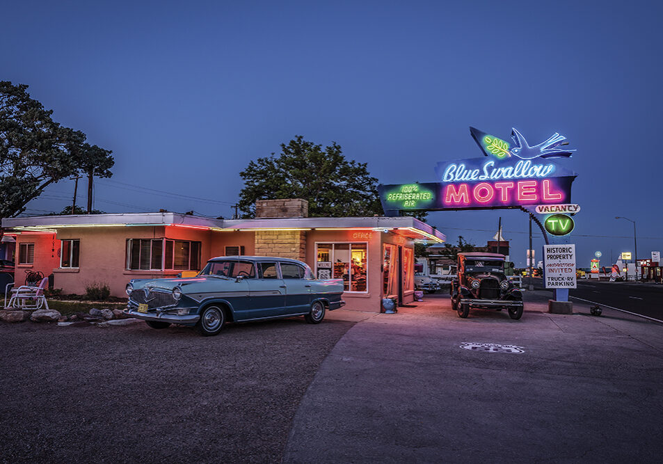 Tucumcari, New Mexico, USA - May 13, 2016 : Historic Blue Swallow Motel with vintage cars parked in front of it. This building is listed on the National Register of Historic Places in New Mexico as a part of historic U.S. Route 66.