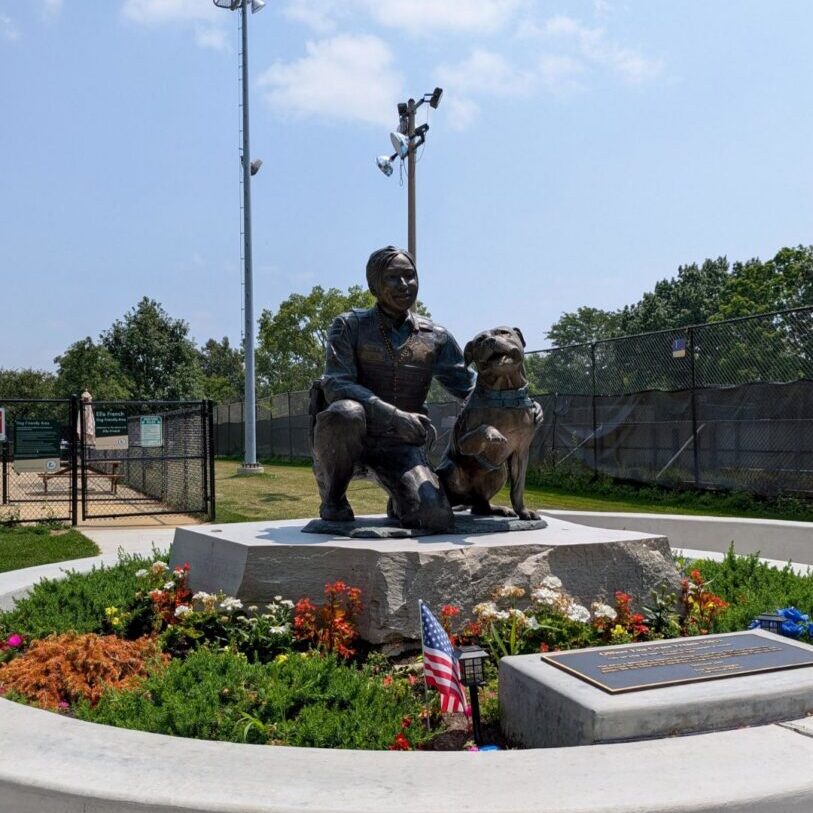 A bronze statue of Officer Ella French and her dog, Bella, was dedicated in Wentworth Park in 2025.