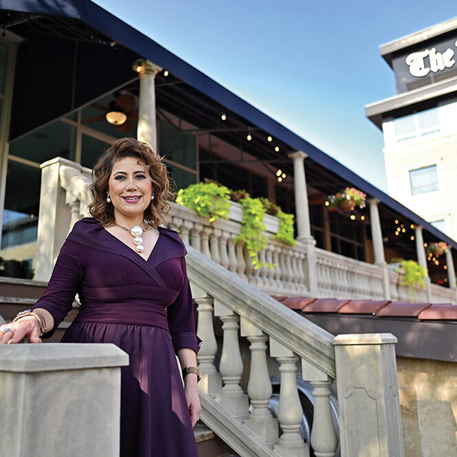 Tely Nagle, Drake Hotel Proprietor, in the Romanesque gardens 
Photo by Victor Hilitski