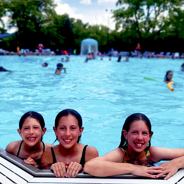 Longtime members Sloane, Ellery and Teegan Smith enjoy a summer swim this season at the pool.