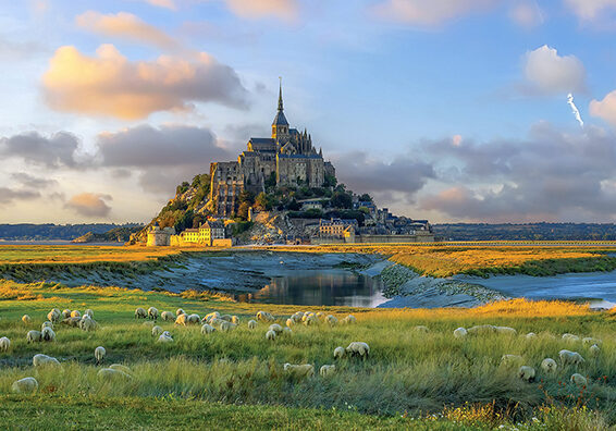 Famous Le Mont Saint-Michel tidal island in Normandy, northern France at sunset